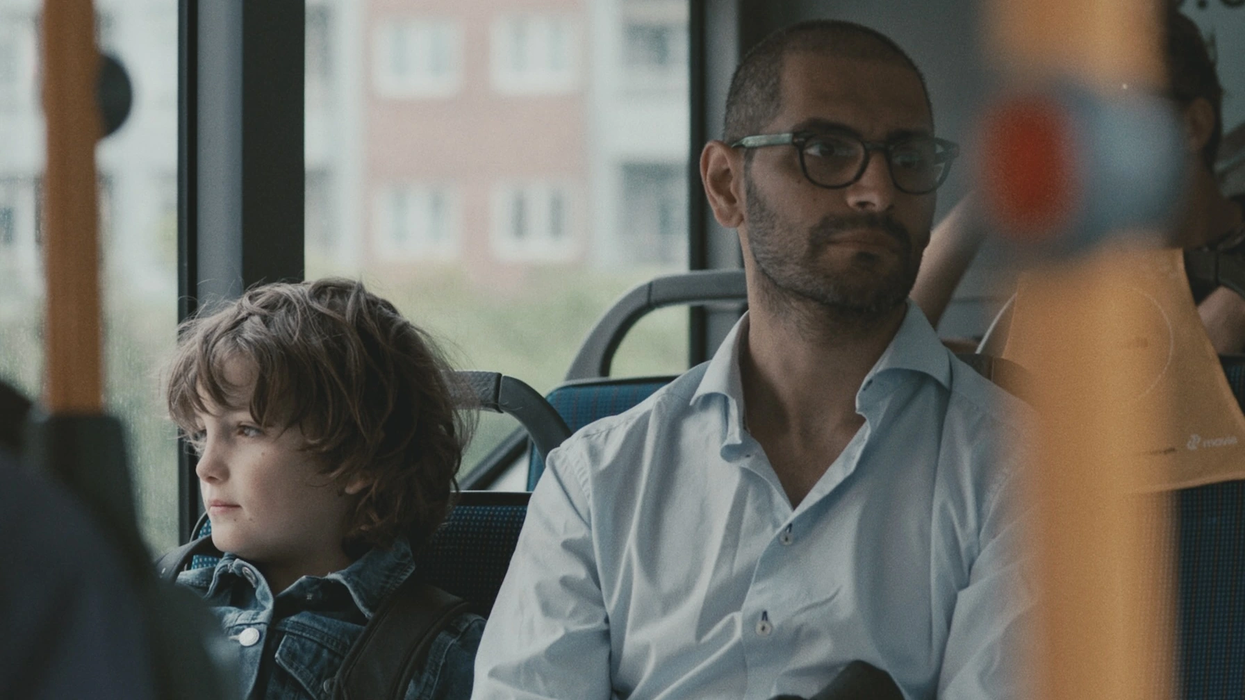 Two people in publich transportation